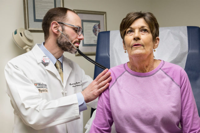 Organ transplant patient Michele Coleman receives a follow-up exam by Ramsey Hachem, MD, medical director of lung transplantation, a few months after receiving a set of new lungs conditioned in a special device under testing. 